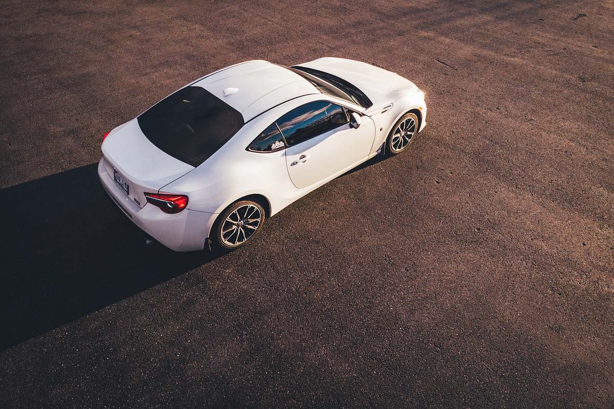 alloy wheel high-angle view of white coupe wheel
